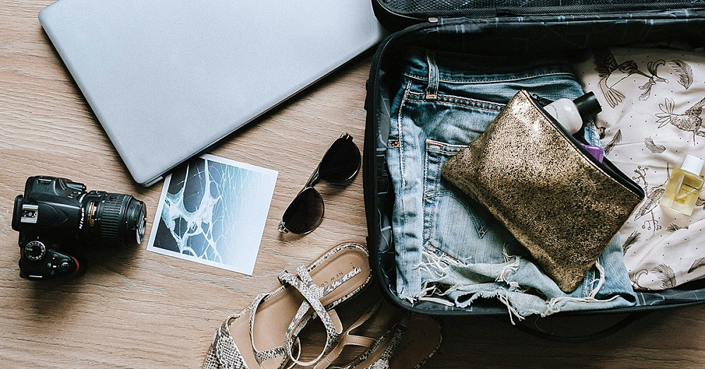 A suitcase and travel paraphernalia